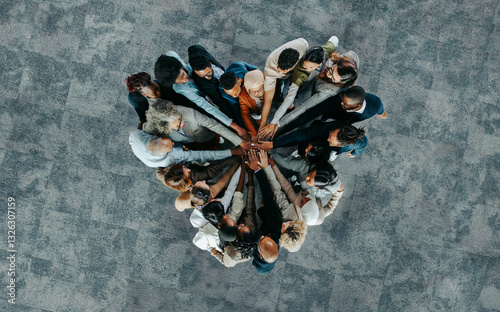Top view of a a heart shape of people, showing unity and teamwork