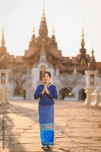 Wallpaper Mural Pretty Asian women traveler in traditional Thai dress. Beautiful conventional Thai dresses Lanna style at Dhara Dhevi in Chiang Mai, Thailand. Tourist attraction. Lanna Fashion Portrait. Torontodigital.ca