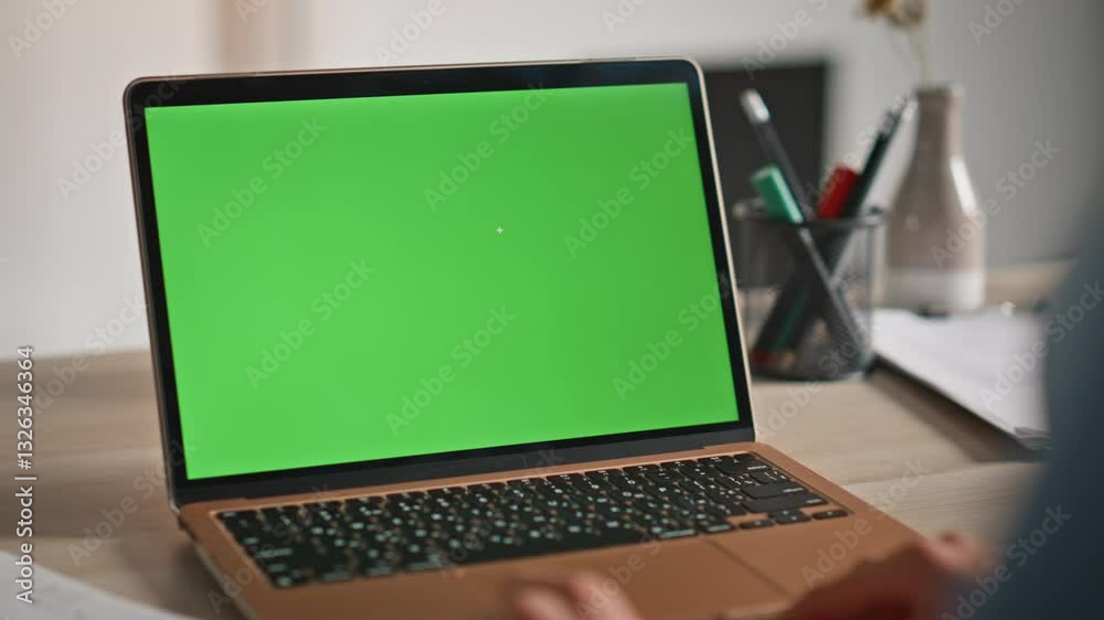 Remote manager using green screen laptop for online work home closeup. Remote manager using green screen laptop for online work home closeup.