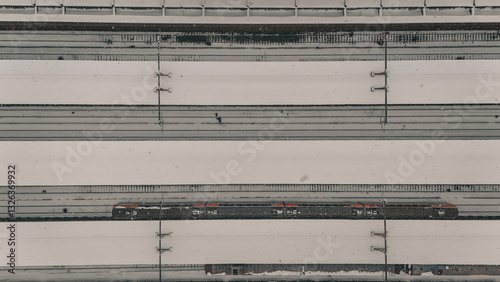 Cuadro en lienzo Aerial view of a snowed covered train station