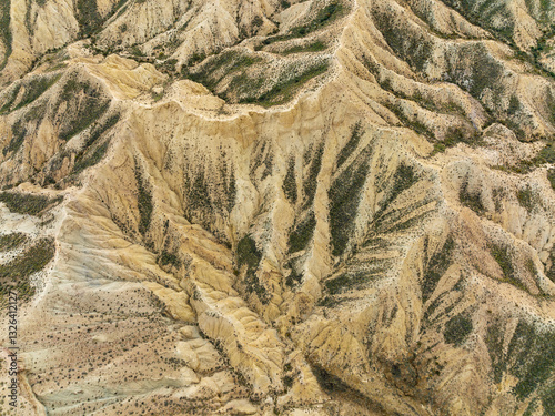 Aerial view of tabernas desert with rugged terrain and rocky formations, Tabernas, Almeria, Spain.