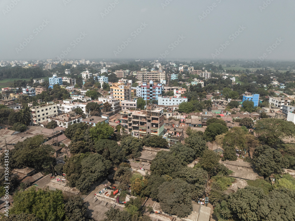 Aerial view of dense urban landscape with residential buildings and greenery, Bhairab, Dhaka, Bangladesh. Aerial view of dense urban landscape with residential buildings and greenery, Bhairab, Dhaka, Bangladesh.