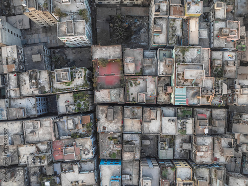 Aerial view of densely packed residential buildings and rooftops in a vibrant urban landscape, Subhadya, Keraniganj, Dhaka, Bangladesh.