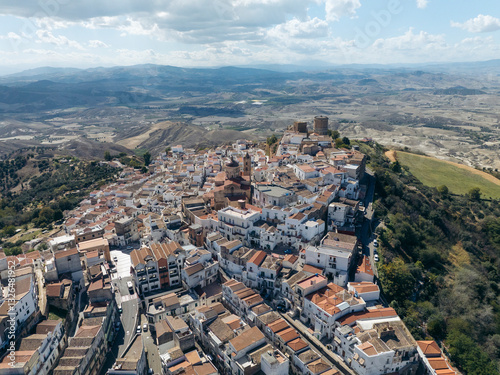 Aerial view of the picturesque medieval old town with charming stone buildings and rooftops on a hilltop, Pisticci, Matera, Italy.