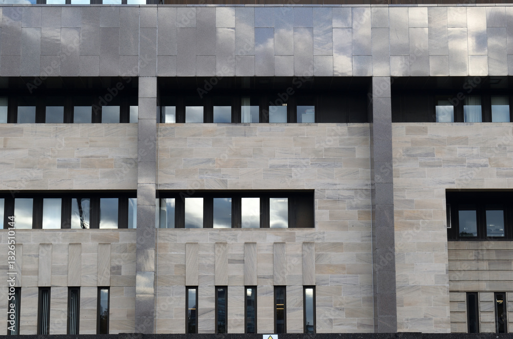 Obraz premium Facade of Modern Office Building with Stone and Metal Cladding 
