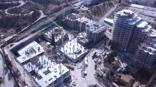 Aerial view of an active construction site for new residential and office space in the city. Real estate development in Tbilisi, Georgia.
