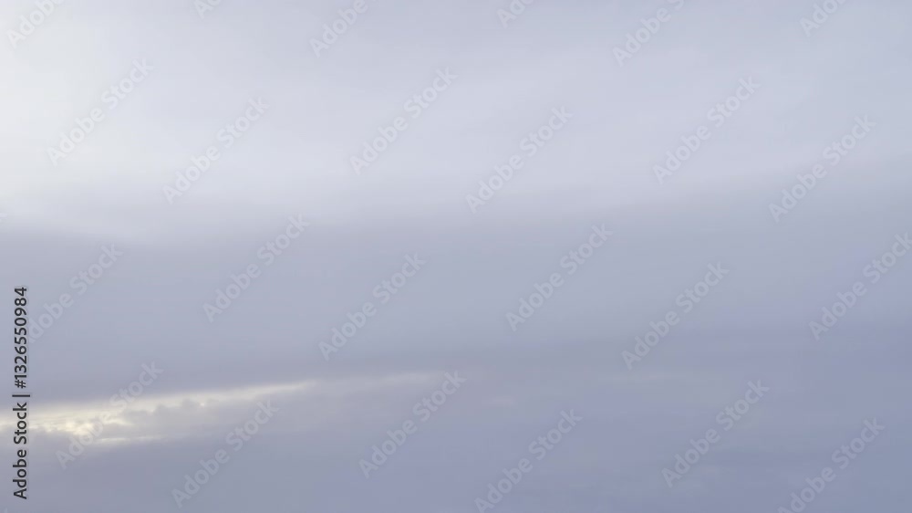 a serene aerial view of the sky with soft clouds below and a gradient of pastel colors at the horizon during sunset. a serene aerial view of the sky with soft clouds below and a gradient of pastel colors at the horizon during sunset.