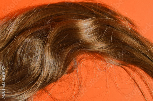 natural, long female hair, grooming, combing hair, hairstyle of a man, a girl. background for the design.