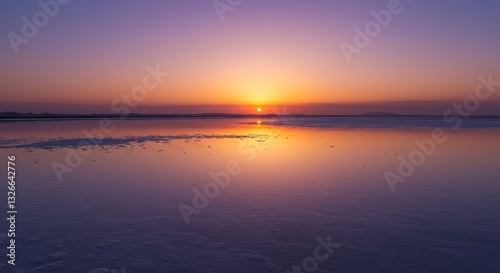 Serene Sunset Over Calm Waters - A breathtaking sunset casts a warm glow over a tranquil body of water, reflecting the vibrant colors of the sky