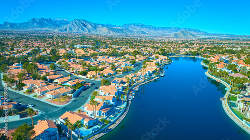 Aerial: Suburban Oasis with Lake and Mountain Vista