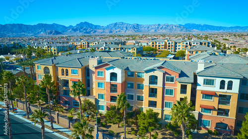 Aerial of Modern Desert Residential Area with Mountain Backdrop