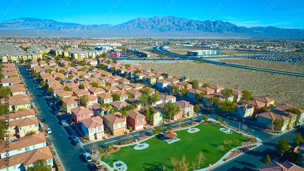 Aerial Suburban Desert Oasis Near Las Vegas with Mountain Backdrop