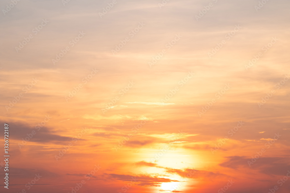 Obraz premium Sky,sunset, beautiful , luxury soft gradient orange gold clouds and sunlight on the blue sky perfect for the background, Sunrise on morning or everning in winter warm time ,Twilight summer,silhouette