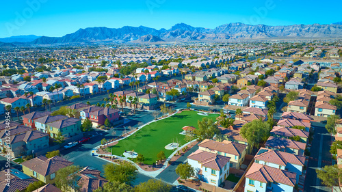 Canvas Print Aerial Suburban Oasis with Desert Mountain Backdrop in Golden Light