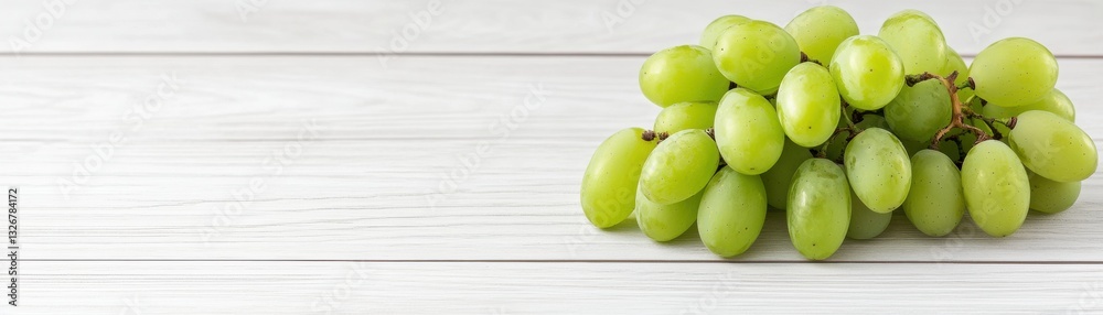 Fresh green grapes arranged on a light wooden surface, highlighting their vibrant color and natural beauty. Fresh green grapes arranged on a light wooden surface, highlighting their vibrant color and natural beauty.