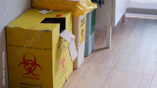 Yellow Disposal Safe box for sharp and clinical waste in a medical clininc.