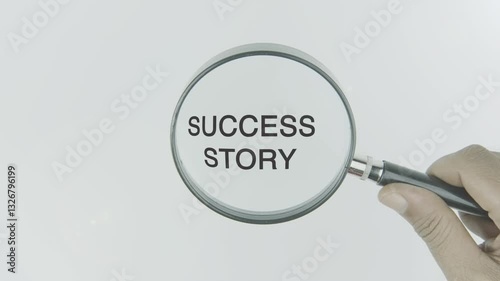 Success story concept highlighted by a magnifying glass in a hand on a white background, symbolizing achievement, growth, and inspiration