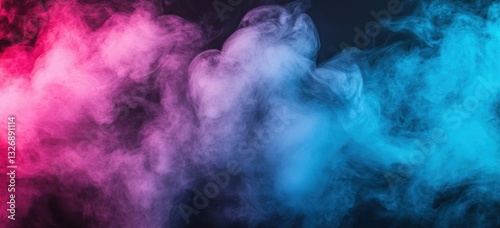 Pink and blue smoke creating abstract shapes on black background