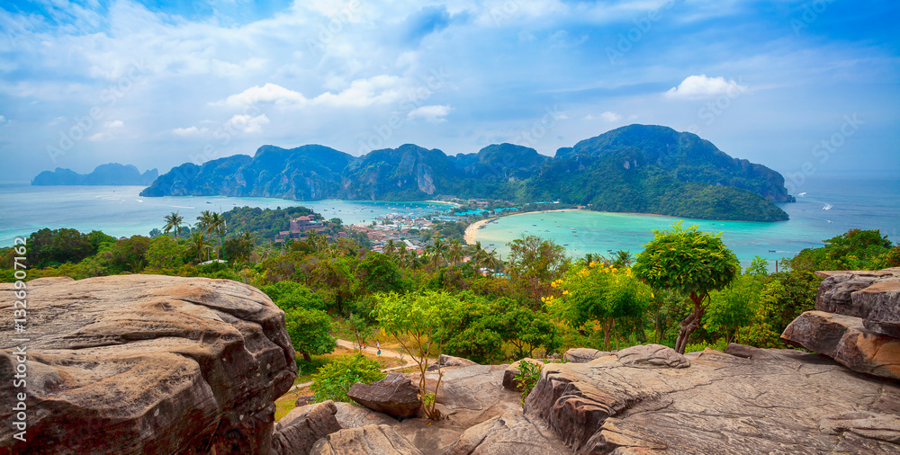 Phi-Phi island viewpoint Krabi Province, Thailand. Famous Koh Phi-Phi Don island with white sand beach and turquoise water under blue sky. Panoramic view of Phi Phi island in Krabi, Thailand