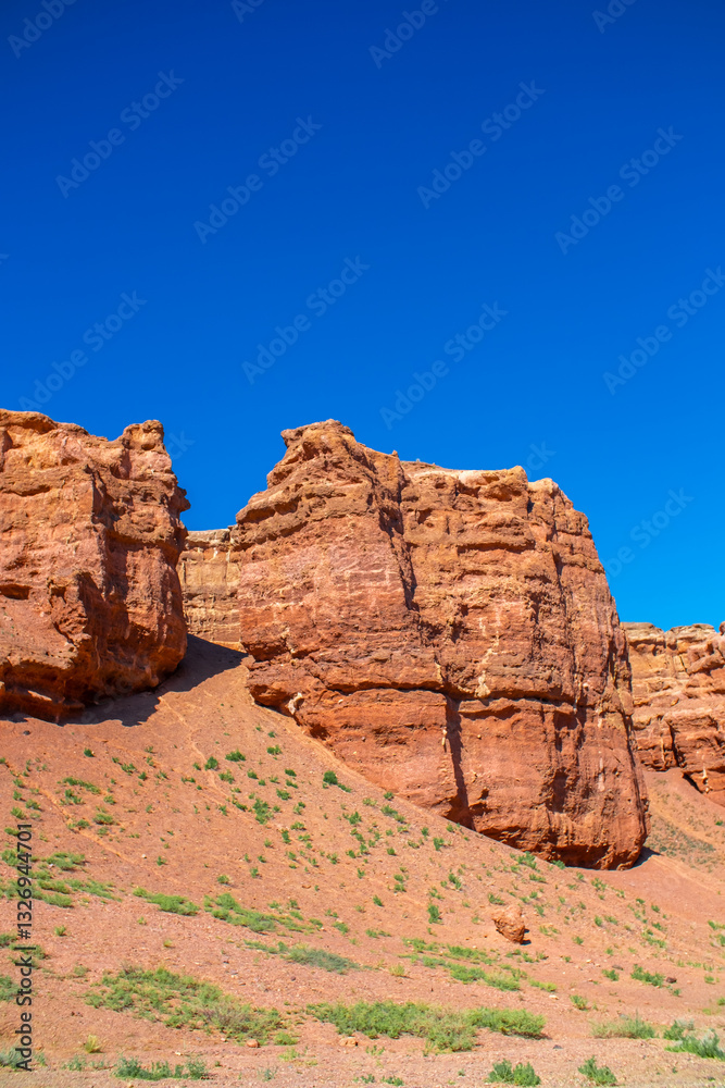 Fototapeta premium Charyn Canyon, Valley of Castles. The excellence of Kazakhstan. Panorama of natural unusual landscape. The red canyon of extraordinary beauty looks like a Martian landscape.