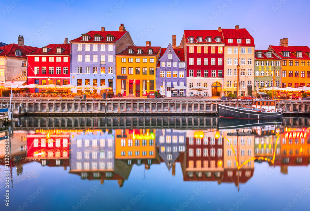Copenhagen, Denmark. Nyhavn, Kobenhavn's iconic canal, colorful night water reflection.