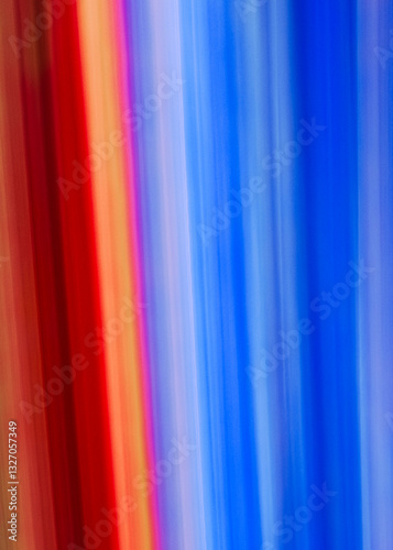 Bright streaks of red, orange, and blue blend together, creating a dynamic flow of colors that evokes energy and passion