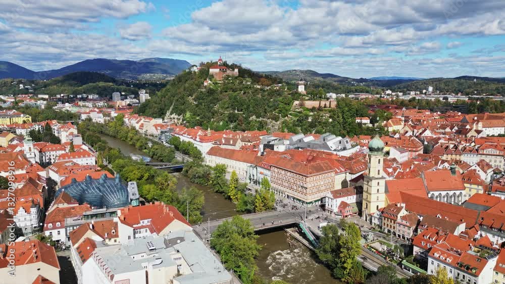 Aerial view of historic old town with uhrturm clocktower and picturesque red roofs, Graz, Styria, Austria. Aerial view of historic old town with uhrturm clocktower and picturesque red roofs, Graz, Styria, Austria.
