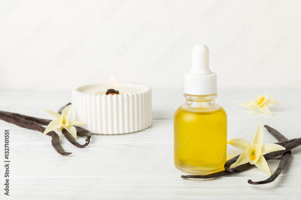Bottle of vanilla essential oil with vanilla flower on textured background. aromatic vanilla beans. Vanilla extract. Spa concept. Beauty and care. Place for text. Copy space. Bottle of vanilla essential oil with vanilla flower on textured background. aromatic vanilla beans. Vanilla extract. Spa concept. Beauty and care. Place for text. Copy space.