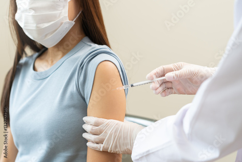 Health care, corona virus, hand of woman nurse, doctor giving syringe vaccine, injection dose on arm sick patient at clinic. Vaccination, immunization disease prevention against flu pandemic influenza