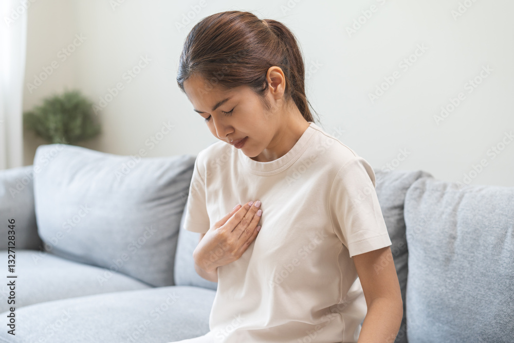 Acid reflux disease, suffer asian young woman have symptom gastroesophageal, esophageal, stomach ache and heartburn pain hand on chest from digestion problem after eat food, Healthcare medical concept Acid reflux disease, suffer asian young woman have symptom gastroesophageal, esophageal, stomach ache and heartburn pain hand on chest from digestion problem after eat food, Healthcare medical concept