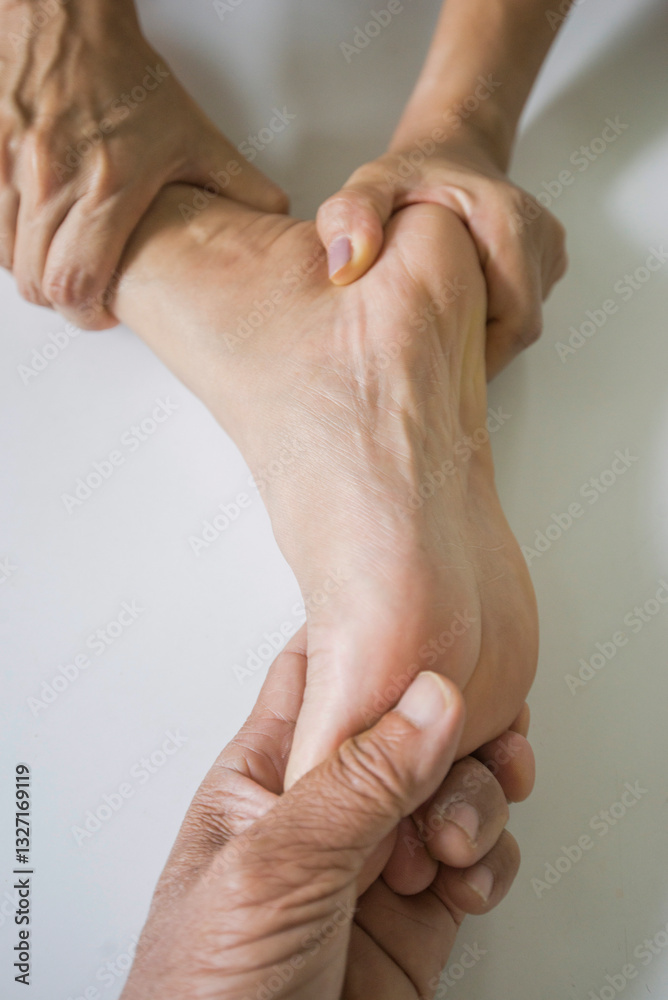 Fototapeta premium Close-up of foot massage to relax muscles.