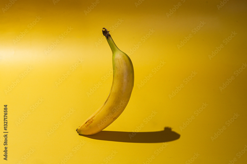 ripe banana on yellow background ripe banana on yellow background