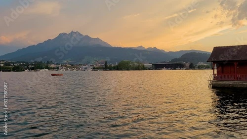 Mount Pilatus and boathouse on Lake Lucerne at sunset, Switzerland landscape
