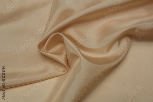 Natural tone beige folded fabric background or texture