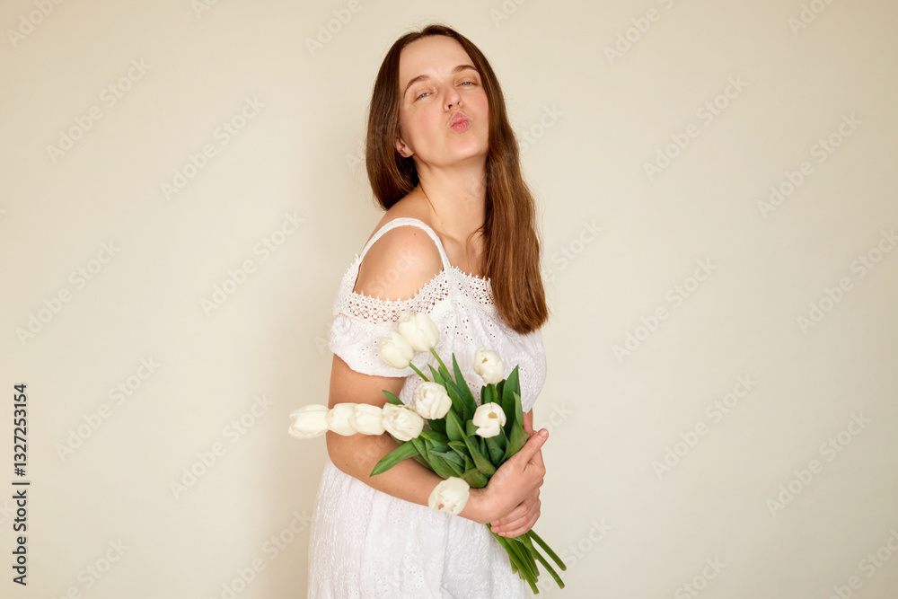 A woman with long brown hair playfully poses with a bouquet of fresh white tulips. She wears a white dress and stands against a simple light background, creating a cheerful atmosphere A woman with long brown hair playfully poses with a bouquet of fresh white tulips. She wears a white dress and stands against a simple light background, creating a cheerful atmosphere