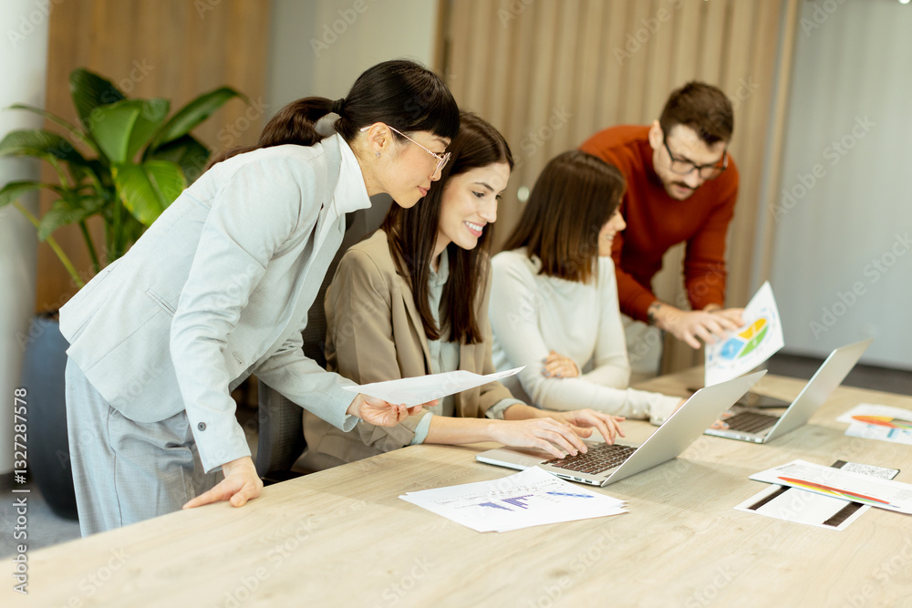 Team collaboration in a modern office environment during a productive brainstorming session Team collaboration in a modern office environment during a productive brainstorming session