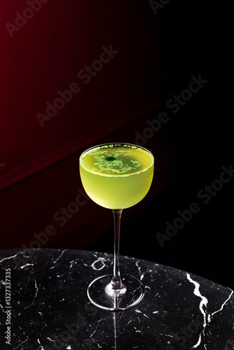 Gin basil smash cocktail in a coupe glass