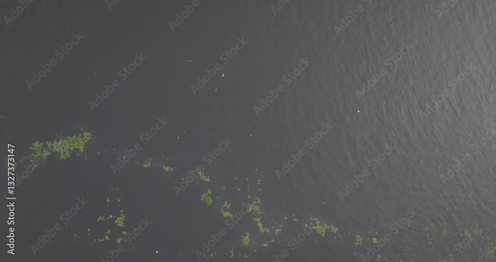 Aerial view of a bustling coal mine with cargo ships and freight vessels in the harbor, Dhaka, Dhaka Province, Bangladesh. Aerial view of a bustling coal mine with cargo ships and freight vessels in the harbor, Dhaka, Dhaka Province, Bangladesh.