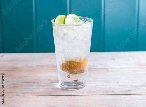 Wallpaper Mural Salted Lemon and Lime Soda with ice cube served in glass isolated on wooden background side view of Hong Kong drink Torontodigital.ca