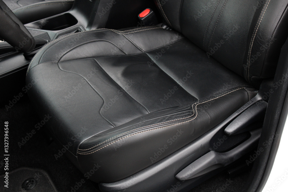 Obraz premium Driver seat of a lux car. Leather car interior. Black leather drivers seat in a car. Front seats of a modern business class sedan car. 