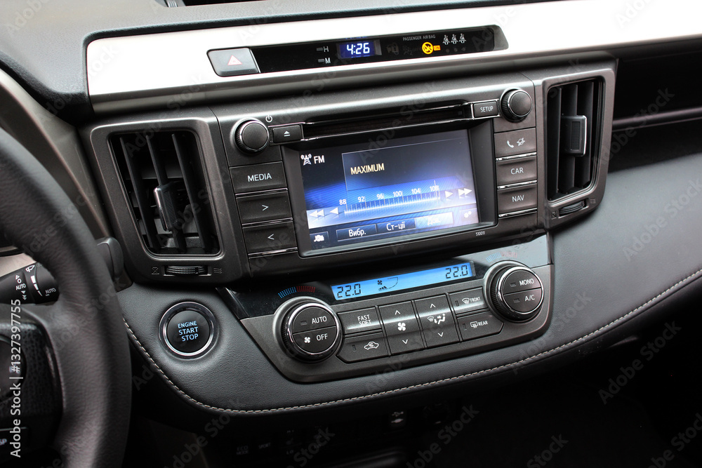 Screen multimedia system on dashboard in modern car. Panel of modern car. Close-up of an electronic dashboard in a modern car. Lux car dashboard with multimedia touch screen. SUV control panel. Screen multimedia system on dashboard in modern car. Panel of modern car. Close-up of an electronic dashboard in a modern car. Lux car dashboard with multimedia touch screen. SUV control panel.
