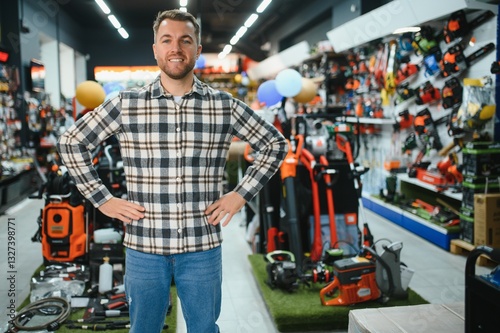 Fotografie Young man working in hardware store