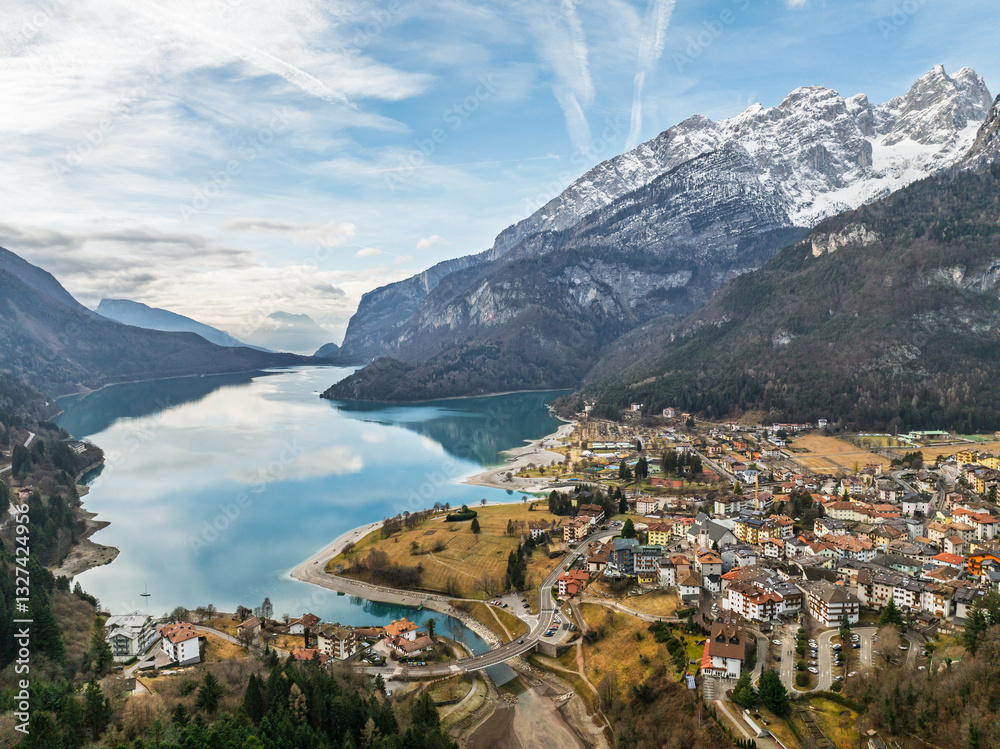 Aerial drone view of Lake Molveno, beautiful lake in Italy. Lake in dolomites from drone in winter. Lake Molveno in Italy. Sailboat, yacht on crystal clear lake in the Brenta Dolomites Aerial drone view of Lake Molveno, beautiful lake in Italy. Lake in dolomites from drone in winter. Lake Molveno in Italy. Sailboat, yacht on crystal clear lake in the Brenta Dolomites