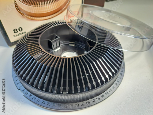 A 35mm film slide projector carousel