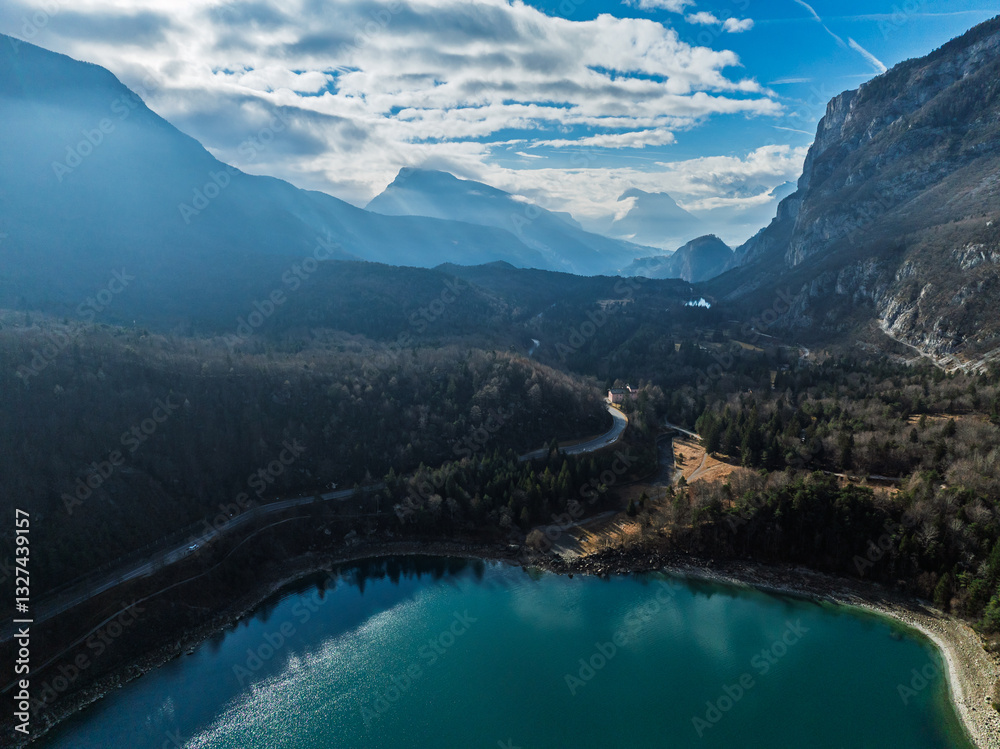Aerial drone view of Lake Molveno, beautiful lake in Italy. Lake in dolomites from drone in winter. Lake Molveno in Italy. Sailboat, yacht on crystal clear lake in the Brenta Dolomites Aerial drone view of Lake Molveno, beautiful lake in Italy. Lake in dolomites from drone in winter. Lake Molveno in Italy. Sailboat, yacht on crystal clear lake in the Brenta Dolomites