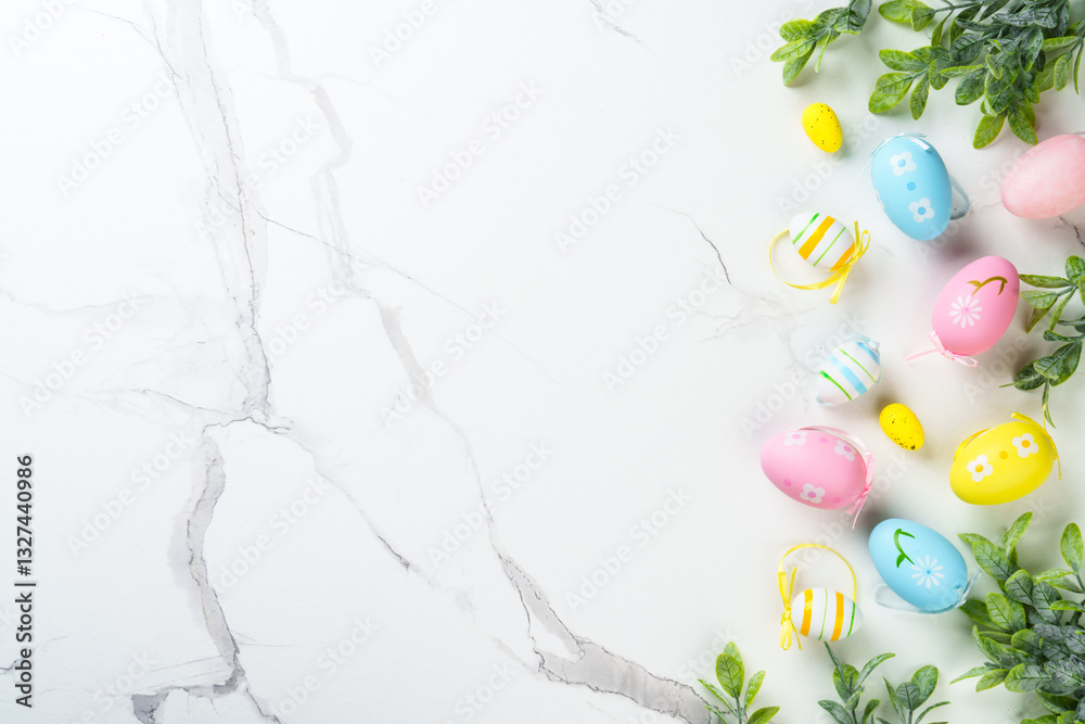 Easter composition with Bunny ears, colored eggs and green plants.