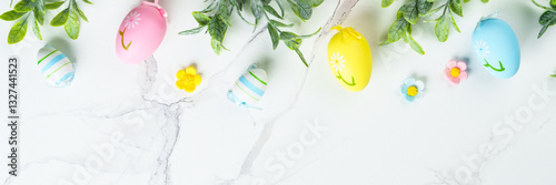 Obraz na płótnie Easter composition with colored eggs and green plants on white background. w salonie