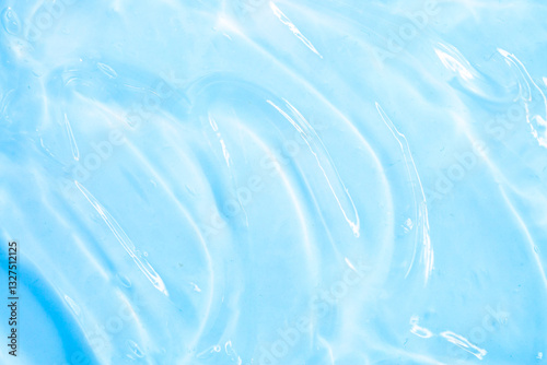 Cosmetic gel, serum transparent sample. Liquid cream with bubble texture. Gel texture of a cosmetic product. Clear liquid lotion for skin care.