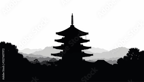 Silhouette of pagoda against mountainous landscape