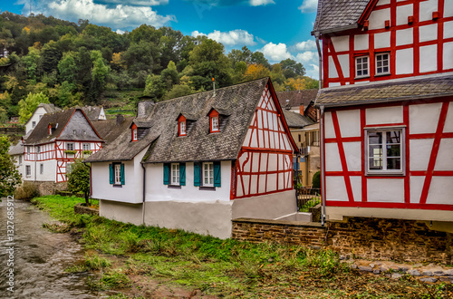 Medieval red half timbered houses in Monreal Germany on the Elzbach river under Lowenburg castle